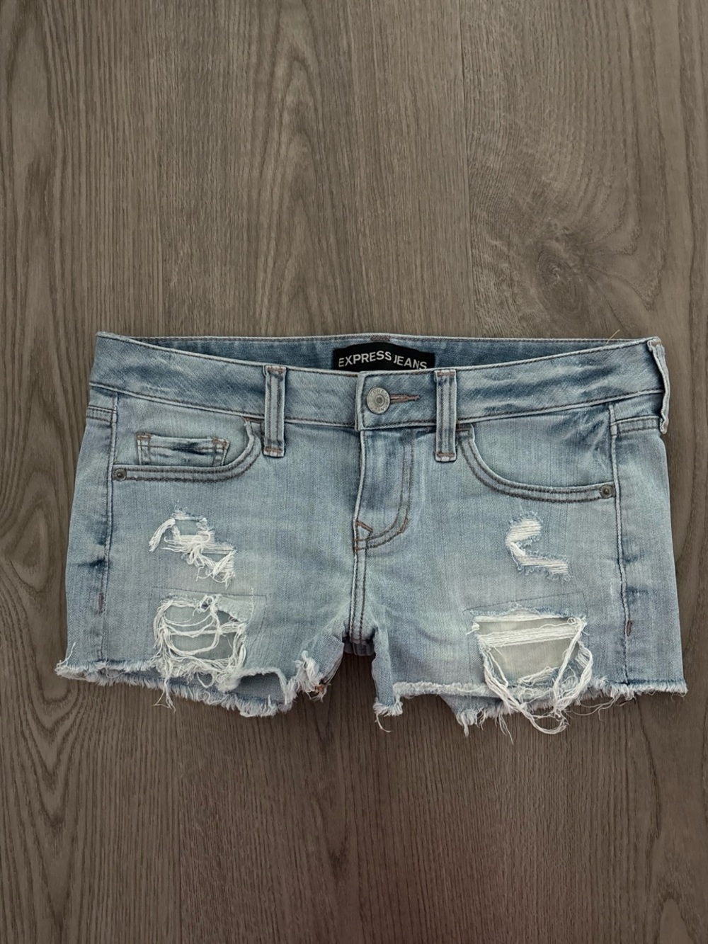 Express blue denim shorts with ripped details low rise size small